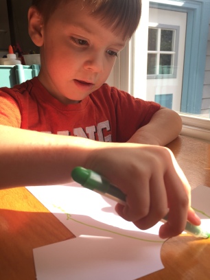 Designing his shirt with green stripes, which he pointed out was "easier than drawing the tiger like on his own shirt".